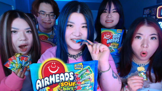 KREW (ItsFunneh and siblings) pose with Airheads Sour Bars in their announcement post for the 6 month collaboration, which kicked off with a livestream on YouTube.
